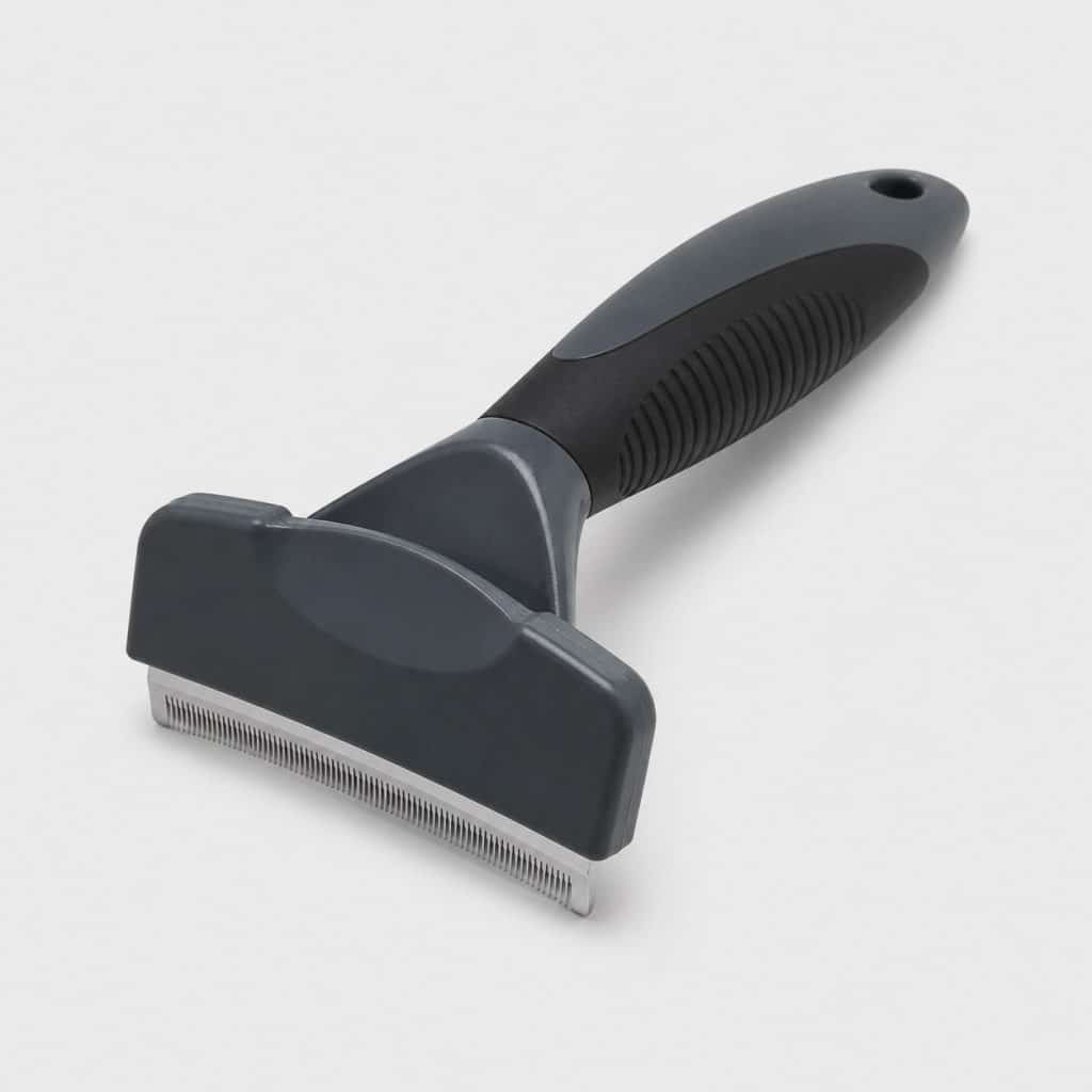 Brosse de mue pour chien à lame fine courbe